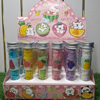 Display of colorful hair ties in a cartoon-themed holder on a grassy background