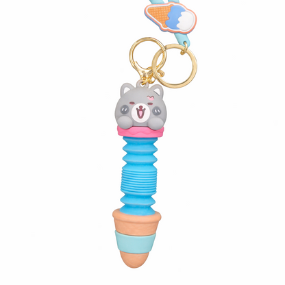 Colorful keychain with a bear-shaped charm on a white background